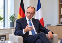 Merz obwinia migrację za zamieszki we Francji! Wskazuje na brak integracji Ilustracja AI: Friedrich Merz podczas rozmowy, z flagami Niemiec i Francji w tle.
