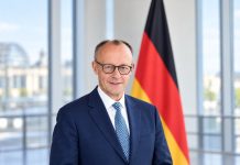 Tańszy prąd dla wszystkich w Niemczech! Merz chce obniżyć podatek do unijnego minimum Ilustracja AI: Friedrich Merz na tle flagi Niemiec