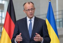 Merz broni 100 miliardów euro pomocy dla Ukrainy! Zapewnia, że nie odbywa się to kosztem świadczeń w Niemczech Ilustracja AI: Friedrich Merz w garniturze, w tle flagi Niemiec i Ukrainy
