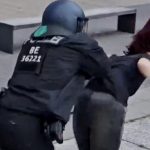 Policjant popchnął protestującą na ziemię