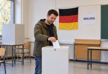 Berlin: Lewica, SPD i Zieloni chcą prawa głosu dla cudzoziemców. Po 5 latach pobytu w Niemczech! Ilustracja AI: fikcyjny dorosły wkłada kartę do urny w niemieckim lokalu wyborczym.